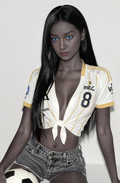Black Neko skinny sex doll seated pose in white soccer jersey and denim shorts holding football, blue eyes, affordable GND love doll by TopLoveDoll